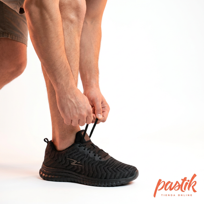 Zapatilla deportiva para hombre Pastikcl en color grafito negro, diseño cómodo y deportivo con suela resistente.